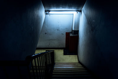 High angle view of empty steps in illuminated building