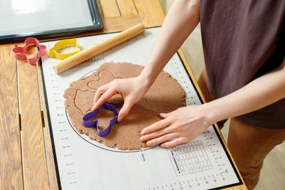 Midsection of man working at table