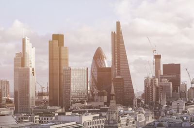 Modern buildings in city against sky