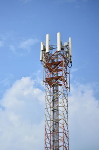 Low angle view of communications tower against sky