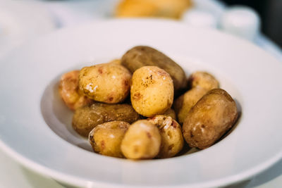 Close-up of potatoes in plate on table