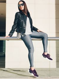 Full length portrait of young woman