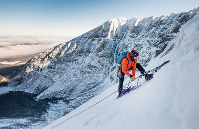 Man skiing on snowcapped mountain