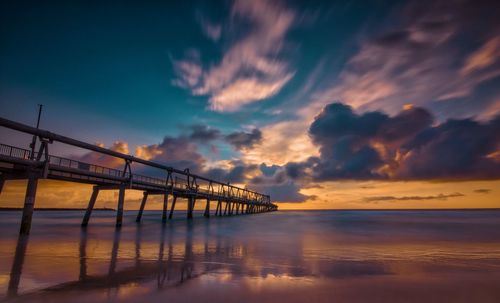 Scenic view of sea against sky at sunset