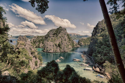 Panoramic view of lake and trees against sky