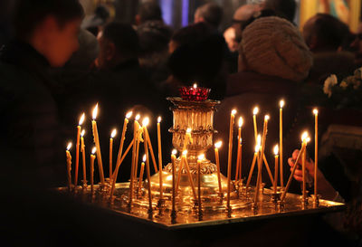 Illuminated candles in temple