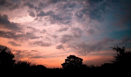 Silhouette of trees against sky at sunset