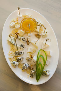 High angle view of fruits in plate on table