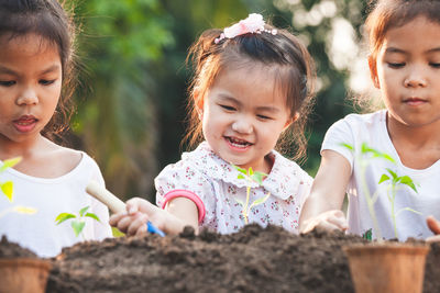 Portrait of cute girl and daughter outdoors