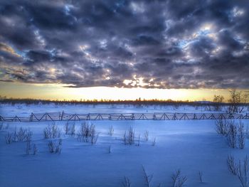 Scenic view of lake against sky during winter