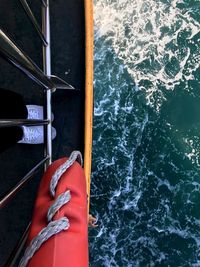 Directly above shot of red life belt on boat sailing in sea
