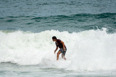 Man surfing in sea