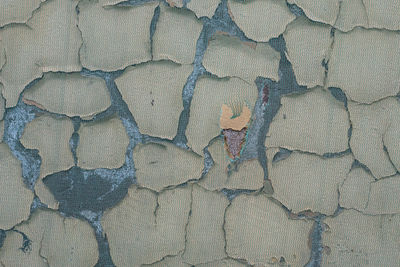 High angle view of heart shape on stone wall