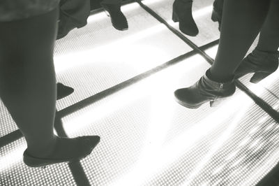 Low section of people standing on floor