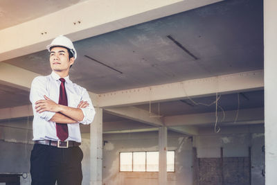 Portrait of man working at airplane