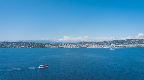 Scenic view of sea against blue sky