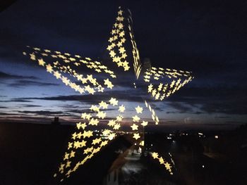 Low angle view of illuminated building at night