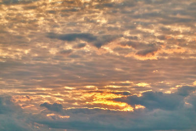 Low angle view of clouds in sky during sunset