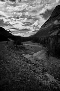 Scenic view of mountains against cloudy sky