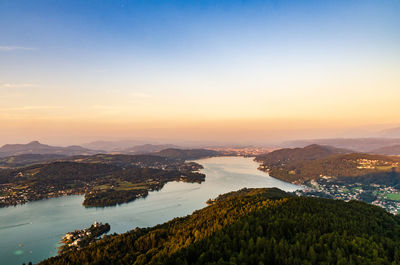 Scenic view of lake against sky during sunset