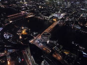 High angle view of illuminated buildings in city at night