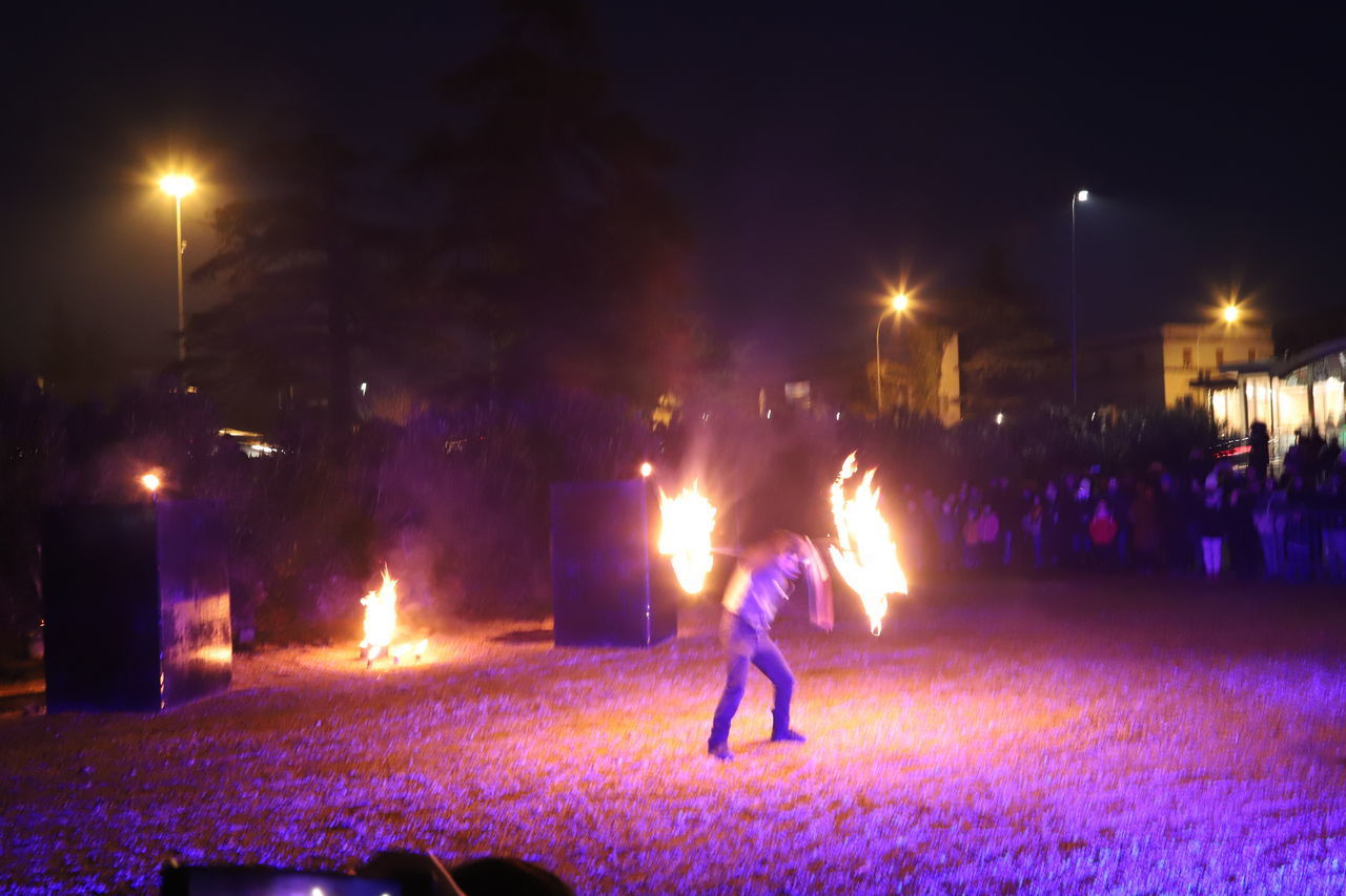 GROUP OF PEOPLE AT NIGHT