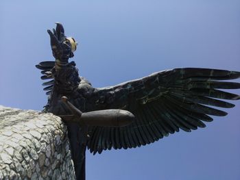 Low angle view of statue against clear sky