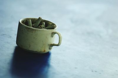 Close-up of coffee cup on table