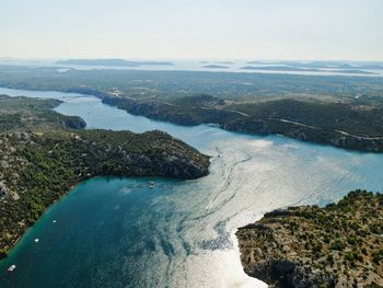 High angle view of sea shore against sky