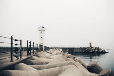 Pier over sea against clear sky