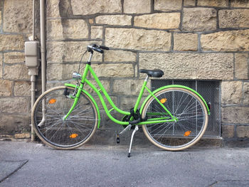 Bicycle leaning on wall