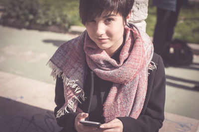 Teenage girl wearing mask in city during autumn