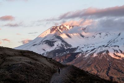 Scenic view of snowcapped mountains against sky during sunset
