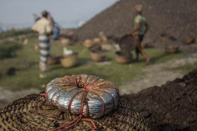 Worker carries basket of coal which to be used in the kiln of a brickfield. khulna, bangladesh.