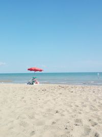 Scenic view of beach against clear sky