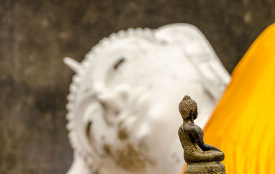 Close-up of angel statue against temple