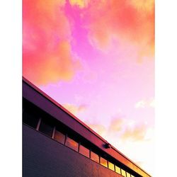 Low angle view of building against sky during sunset