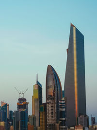 Modern buildings in city against sky