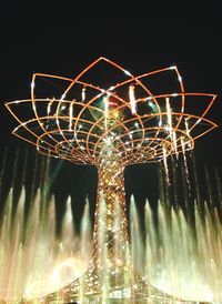 Low angle view of illuminated ferris wheel