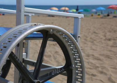 Close-up of empty chair on beach