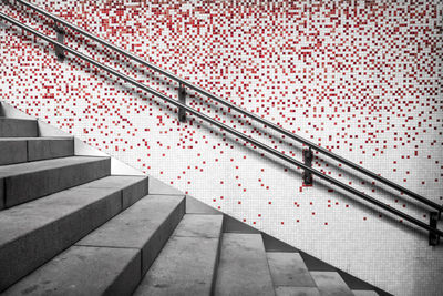 Empty staircases by patterned wall