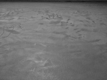High angle view of wet sand on beach