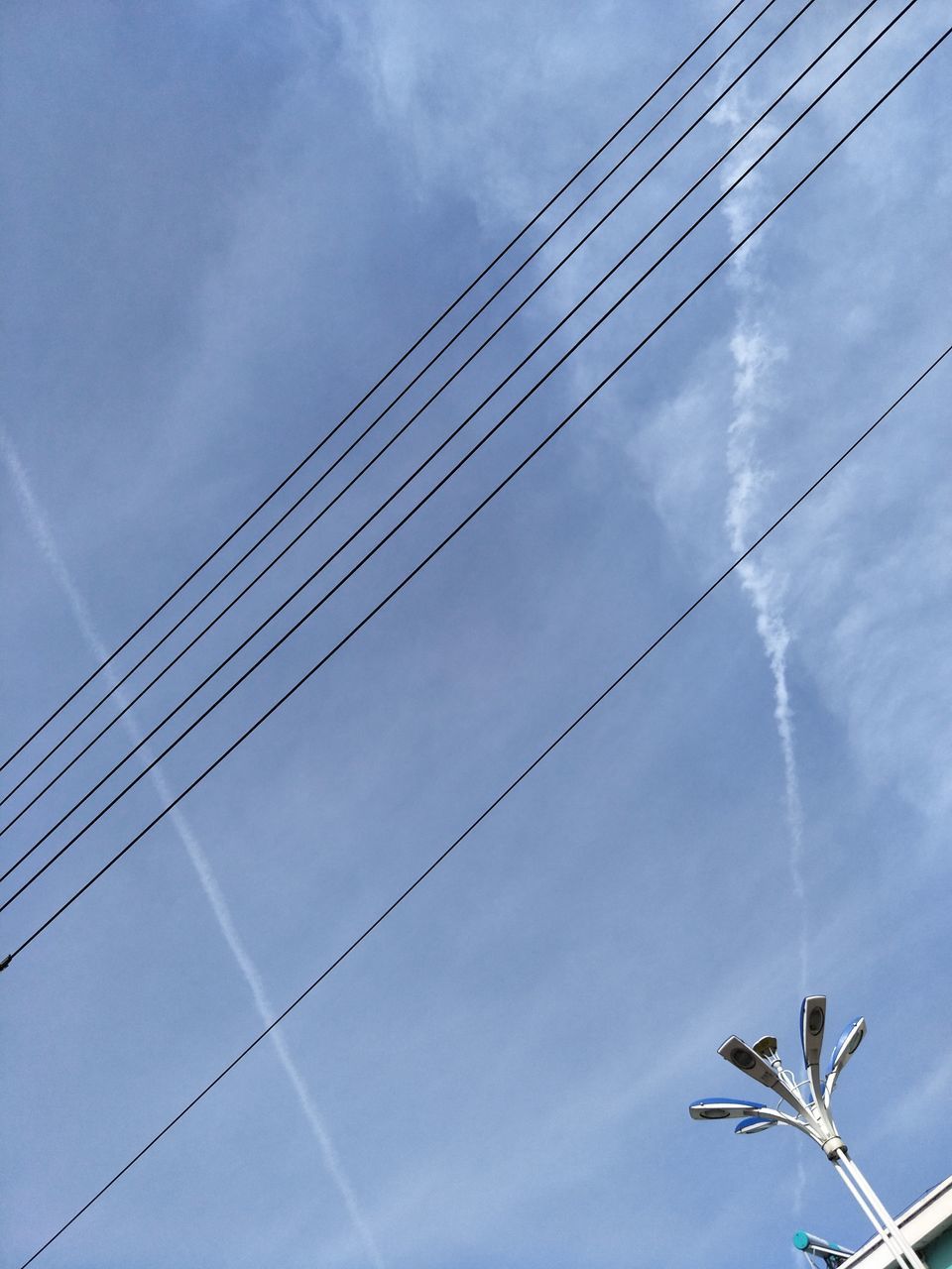 LOW ANGLE VIEW OF POWER LINES AGAINST SKY