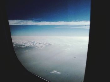 Aerial view of city seen through airplane window