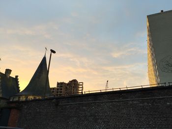 View of buildings against cloudy sky