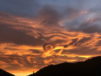 Scenic view of dramatic sky during sunset