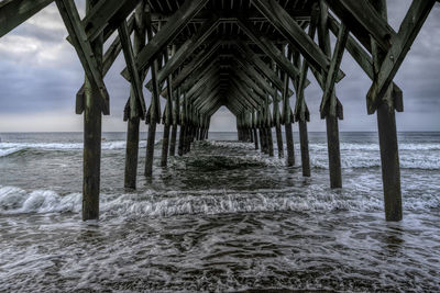 Pier over sea against sky