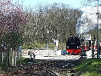 Train on railroad track against sky