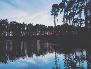 Scenic view of lake at sunset