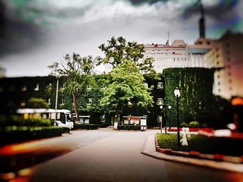 Empty road along buildings